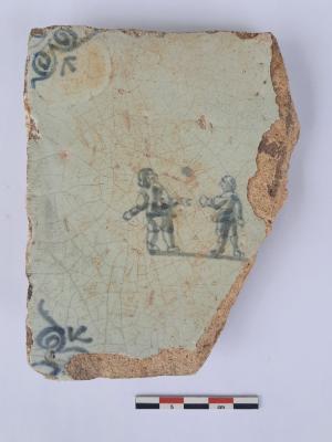 Tegel met twee kaatsende figuren, ossekop als hoekmotief.